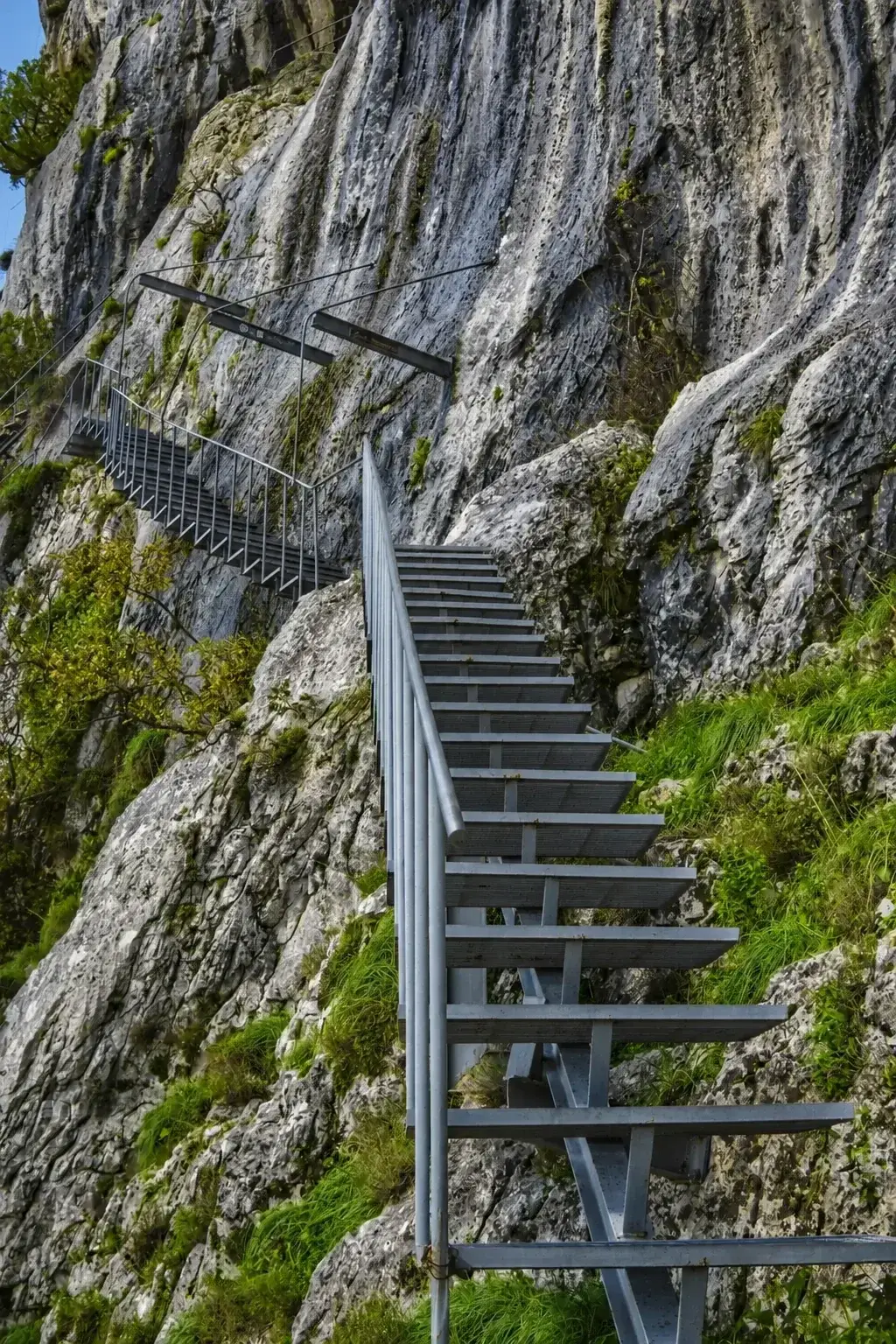 Bolted steel — the last forty meters of the Gamti ascent.